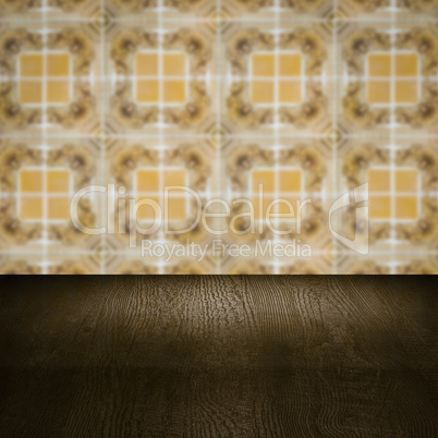 Wood table top and blur vintage ceramic tile pattern wall