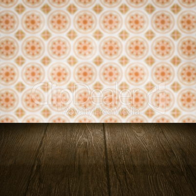 Wood table top and blur vintage ceramic tile pattern wall