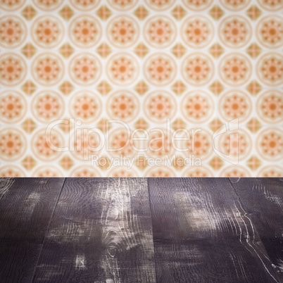 Wood table top and blur vintage ceramic tile pattern wall