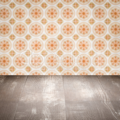 Wood table top and blur vintage ceramic tile pattern wall Wood table top and blur vintage ceramic tile pattern wall