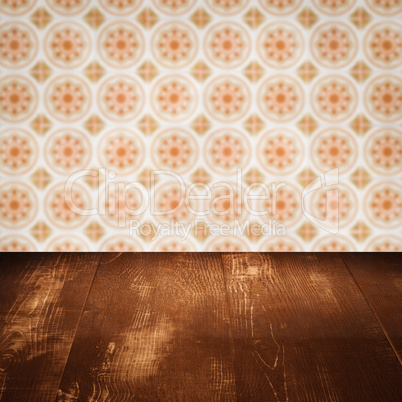 Wood table top and blur vintage ceramic tile pattern wall