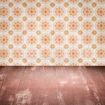Wood table top and blur vintage ceramic tile pattern wall Wood table top and blur vintage ceramic tile pattern wall