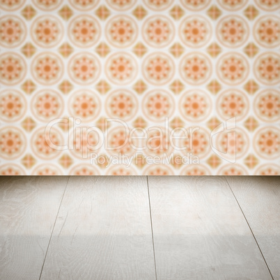 Wood table top and blur vintage ceramic tile pattern wall