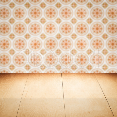 Wood table top and blur vintage ceramic tile pattern wall