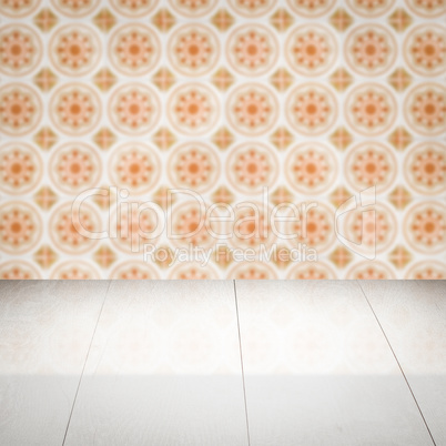 Wood table top and blur vintage ceramic tile pattern wall