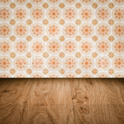 Wood table top and blur vintage ceramic tile pattern wall