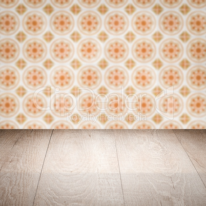 Wood table top and blur vintage ceramic tile pattern wall