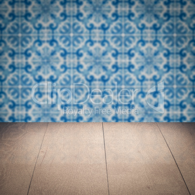 Wood table top and blur vintage ceramic tile pattern wall Wood table top and blur vintage ceramic tile pattern wall