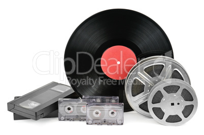 vinyl record, video and audio cassettes isolated on white backgr