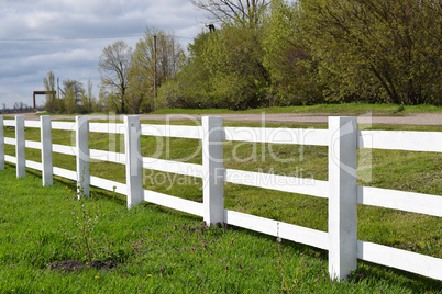 White wooden fence around the ranch