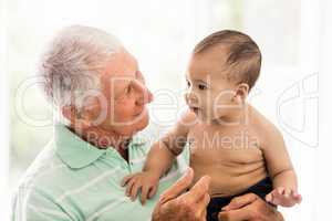 Senior man playing with his grandson