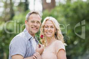 Husband offering a rose to wife