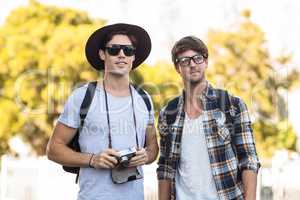 Hip men holding digital camera