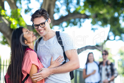 Hip couple about to kiss