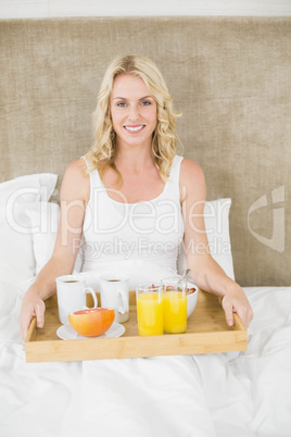 Woman having breakfast in bed