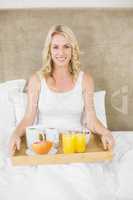 Woman having breakfast in bed