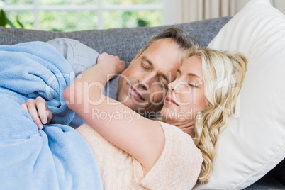 Cute couple sleeping on the couch