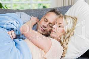 Cute couple sleeping on the couch