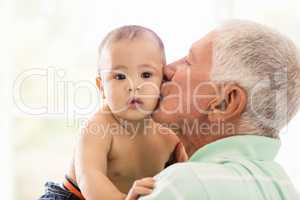 Senior man playing with his grandson