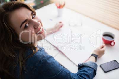 Casual businesswoman working at her desk