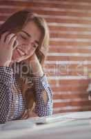 Young hipster businesswoman calling with her phone