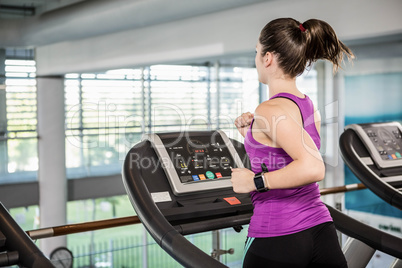 Fti brunette running on treadmill