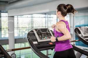 Fti brunette running on treadmill