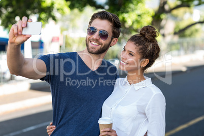 Hip couple taking selfie