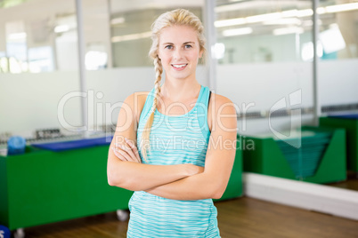 Smiling woman with arms crossed