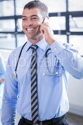 Happy doctor on the phone