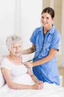 A smiling nurse with her patient