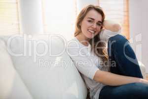 Smiling woman posing on the couch