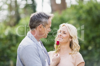 Husband offering a rose to wife