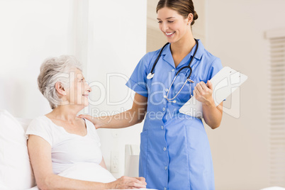 Doctor taking care of suffering senior patient