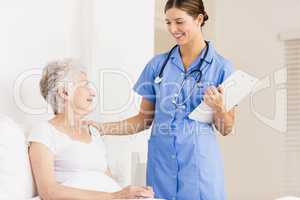 Doctor taking care of suffering senior patient