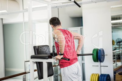 Muscular man doing pull up