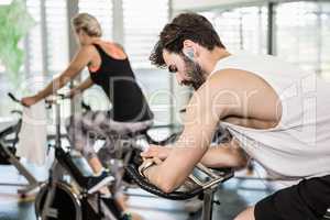 Fit couple on exercise bikes