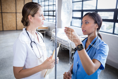 Medical team preparing an IV drip