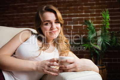 Pretty woman drinking coffee