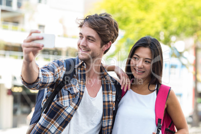 Hip couple taking selfie