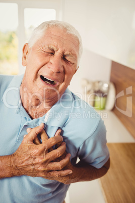 Painful senior man with pain on heart