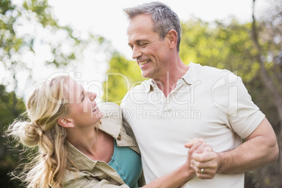 Cute couple dancing and holding hands