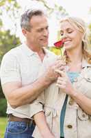 Husband offering a rose to wife