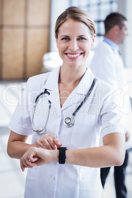 Nurse checking her smart watch