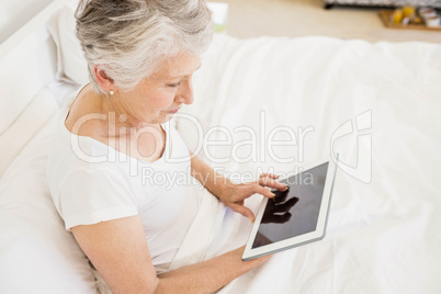 Smiling woman using tablet