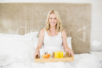 Woman having breakfast in bed