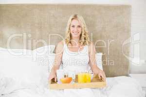 Woman having breakfast in bed