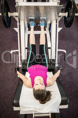 Fit brunette doing exercises for legs