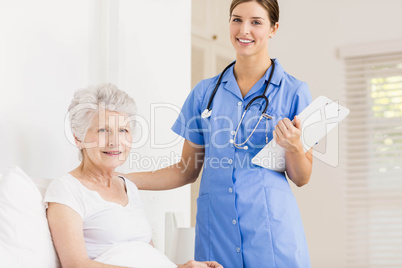 Doctor taking care of suffering senior patient