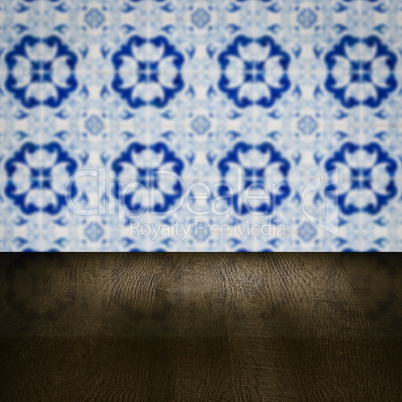 Wood table top and blur vintage ceramic tile pattern wall